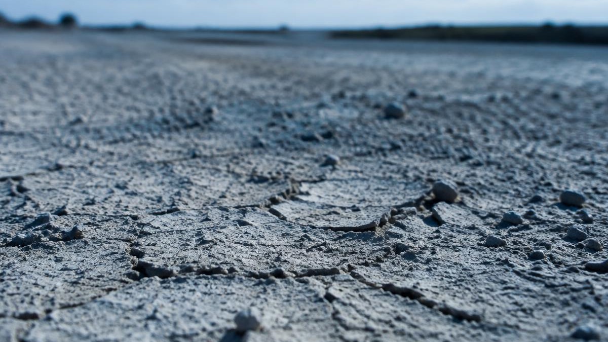 eco-friendly dust control B D Guar soil crust on mining haul road